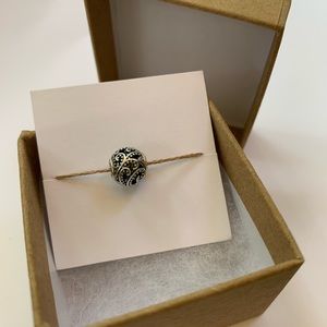 Pandora Essence “Freedom” sterling charm in a kraft gift box